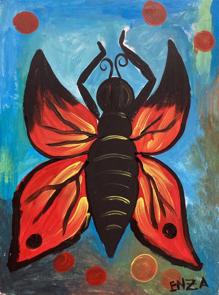 papillon rouge vif sur fond bleu qui rappelle le ciel